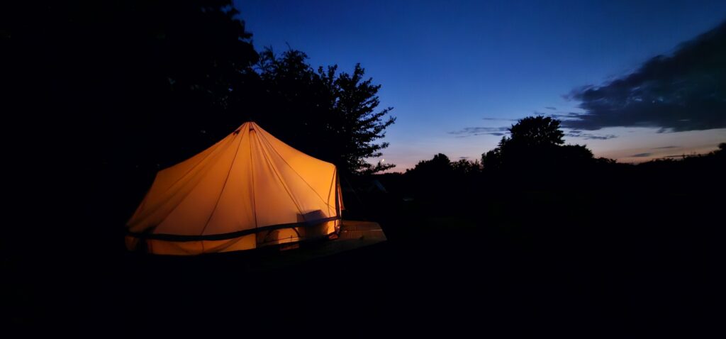Bell tent lit up at night