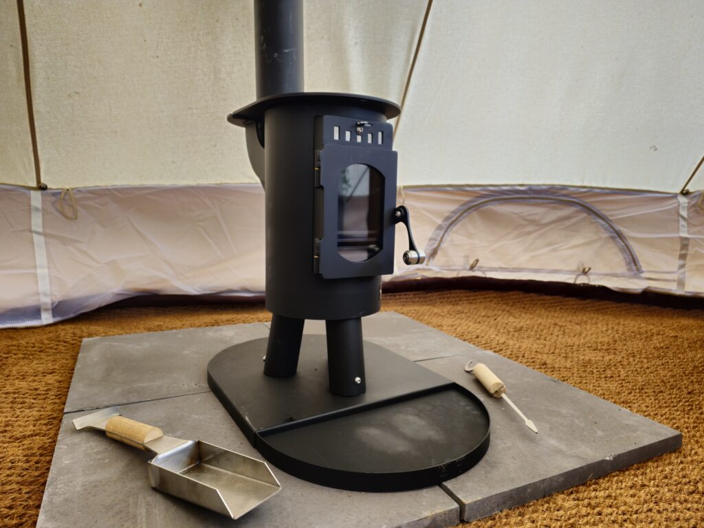 In tent wood burning stove.